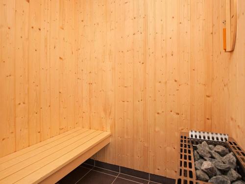 a sauna with a bench in a wooden wall at 6 person holiday home in Gro enbrode in Großenbrode