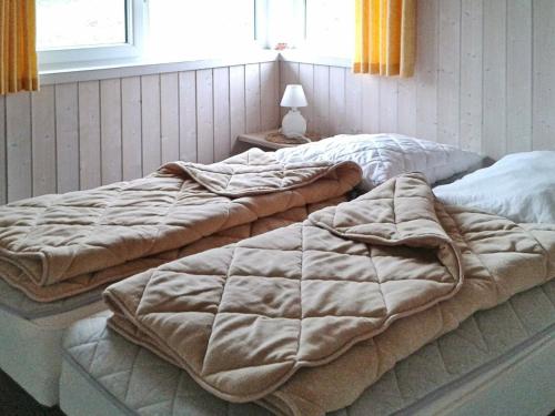 En eller flere senger på et rom på Three-Bedroom Holiday home in Otterndorf 13