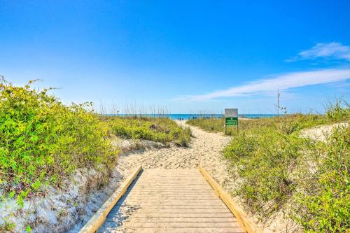 a wooden path leading to a sandy beach at Pool and Beach Access Hilton Head Coastal Condo in Hilton Head Island