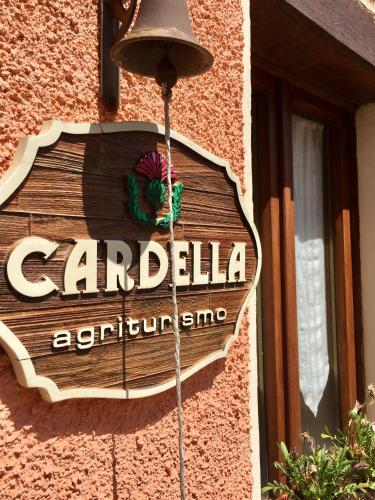 a sign for a restaurant on the side of a building at Agriturismo Cardella in Piobbico