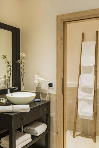 a bathroom with a sink and a mirror at RELAIS COLLE BUONO in Alvito