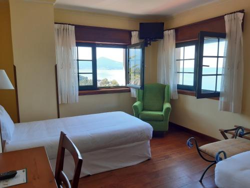 Postel nebo postele na pokoji v ubytování Hotel Rústico Punta Uia