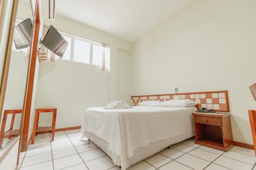 Postel nebo postele na pokoji v ubytování Hotel Metropolitano