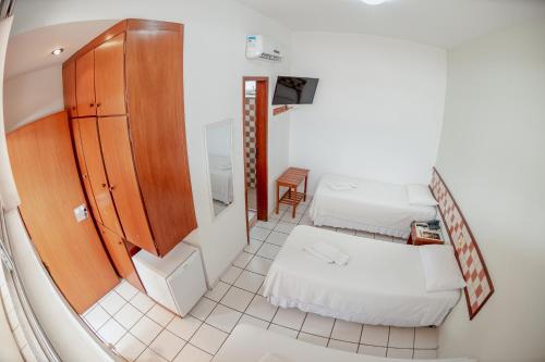 Postel nebo postele na pokoji v ubytování Hotel Metropolitano