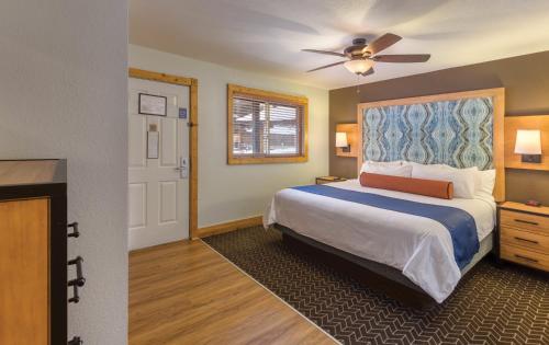 a bedroom with a bed and a ceiling fan at WorldMark Red River in Red River