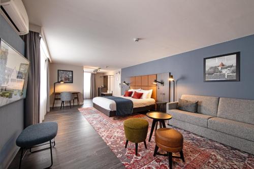 Postel nebo postele na pokoji v ubytování Hotel De Bilderberg