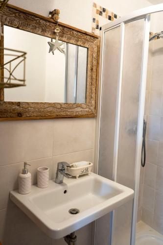 a bathroom with a sink and a shower at Solemagia in Vernazza