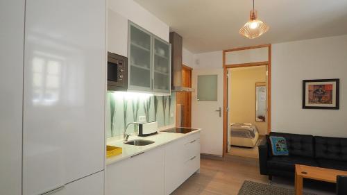 a kitchen with a sink and a counter top at Sao Vicente - Lissabon Altstadt in Lisbon