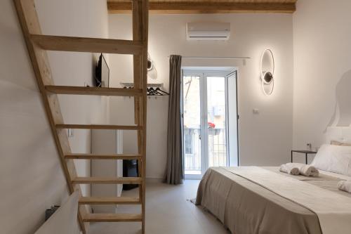 Llit o llits en una habitació de Sicily Dreams Luxury