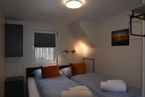 a living room with a couch and a window at Floating vacationhome Sylt in Maastricht