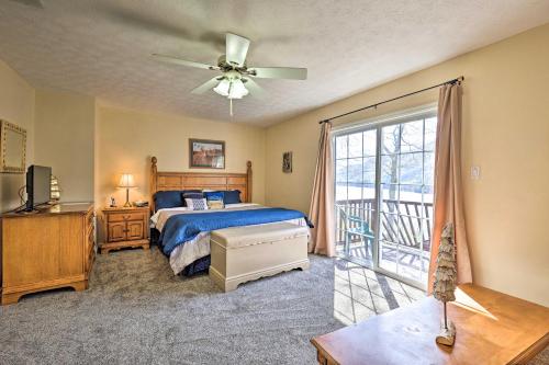 a bedroom with a bed and a ceiling fan at Mountainside Retreat Stunning Watauga Lake Views! in Butler