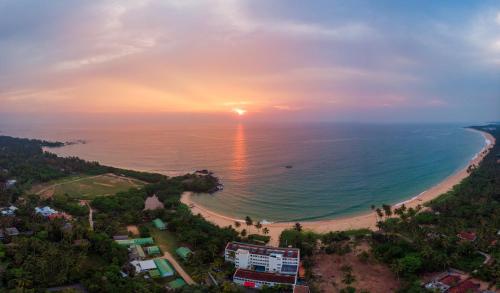an aerial view of a beach at sunset at Shinagawa Beach in Balapitiya
