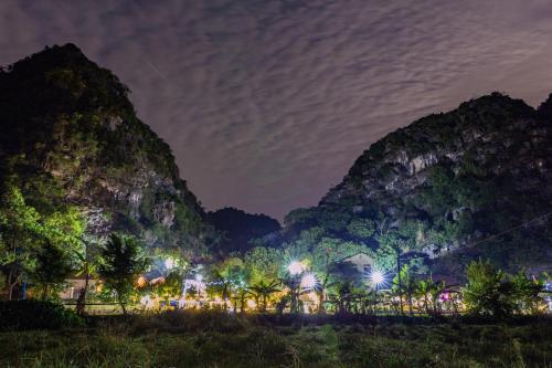a view of the mountains at night at Green Mountain Homestay in Ninh Binh
