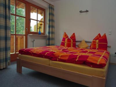 Postel nebo postele na pokoji v ubytování Kainhäusl Aigner GbR