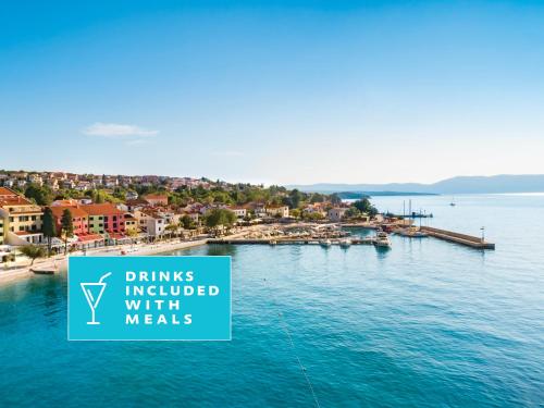 a sign that reads drinks included with meals next to a body of water at Veya Maradiso Hotel by Aminess in Njivice
