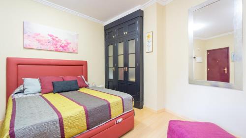 En eller flere senge i et værelse på Palacio de las Dueñas