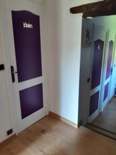 a hallway with a door with the word faith on it at L OLIVIER DE ST LEGER in Château