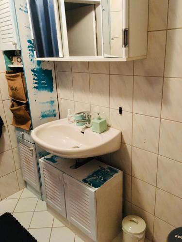 a bathroom with a sink and a mirror at Kunst am Rothaarsteig in Brilon Centrum in Brilon