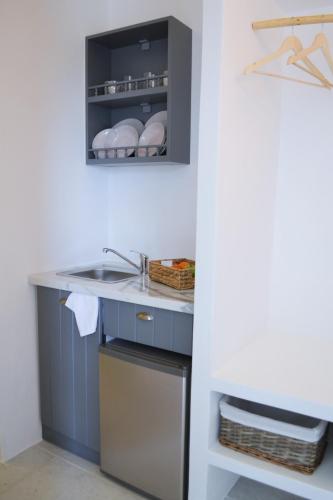 a kitchen with a sink and a counter at Krotiri View Paros in Krotiri
