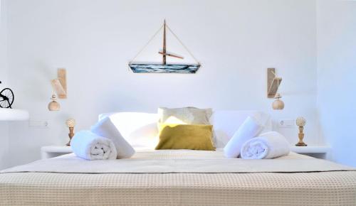 a bedroom with a bed with a sail on the wall at Krotiri View Paros in Krotiri