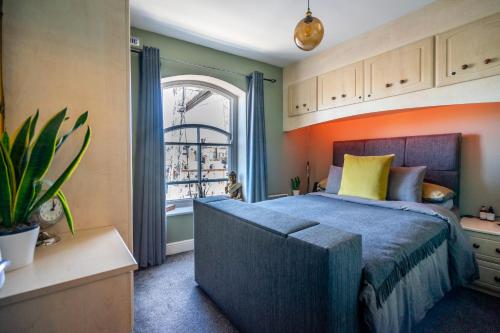 a bedroom with a large bed and a window at Quayside in York