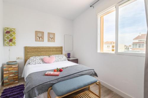 Una cama o camas en una habitación de Apartamento Flamingo