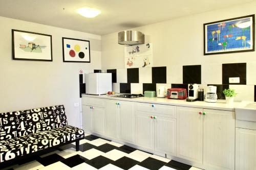 a kitchen with a counter and a chair in a room at Hana place in Motovun