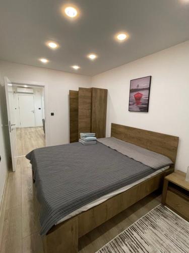 Säng eller sängar i ett rum på LUNA Apartment