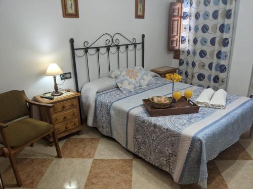 A bed or beds in a room at Hostal Moraima