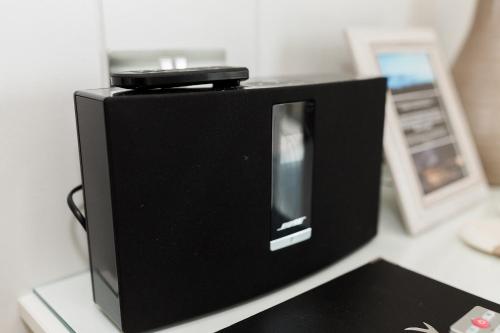 a black microwave sitting on top of a counter at Sea View Snugs at Laggan in Gatehouse of Fleet