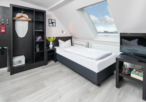 Postel nebo postele na pokoji v ubytování City Hotel Kaiserhof
