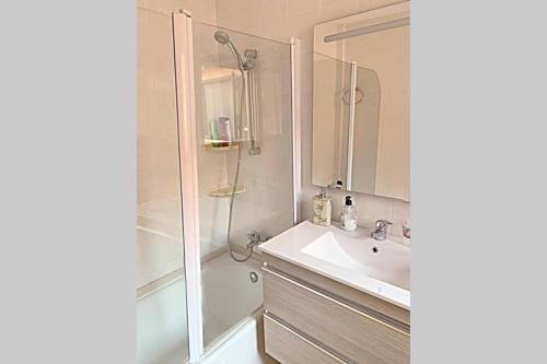 a bathroom with a shower and a sink and a mirror at Panoramic sea and Ifach views in Calpe in Calpe