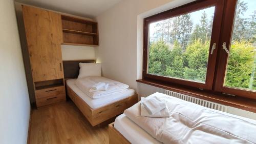 Postel nebo postele na pokoji v ubytování Absolute Active Mountain Resort