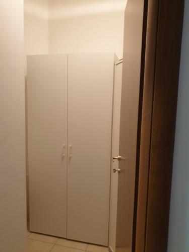 a white cabinet in a room with a mirror at Casa di Anna in Todi