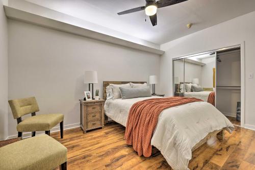 a bedroom with a bed and a chair and a mirror at Renovated Dtwn Retreat Less Than 1 Mi to Plaza Park! in San Marcos