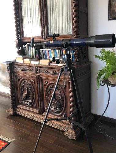 a camera on a tripod in front of a book shelf at Conacul Paloși in Horezu