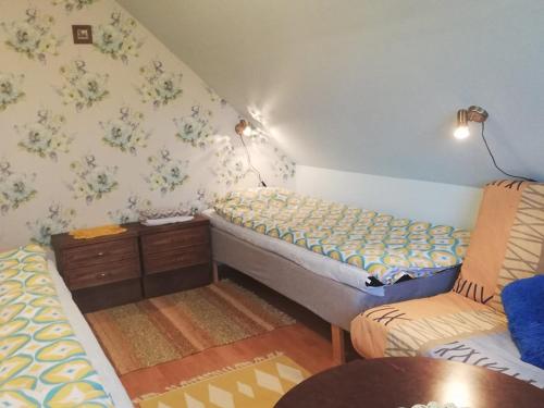 Postel nebo postele na pokoji v ubytování Kullerkupu Hostel