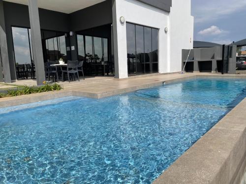 a large swimming pool in front of a building at Mikey's place with Fibre Uncapped WiFi in Midrand