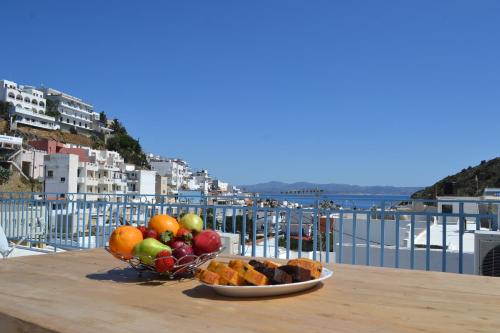 a bowl of fruit on a table with a view at Michalis Captain Home in Agia Galini