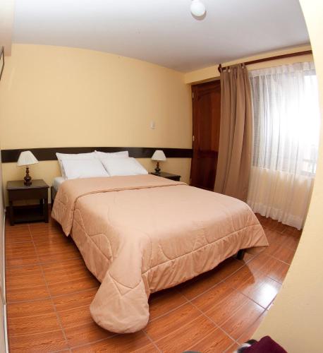 Postel nebo postele na pokoji v ubytování Yucay Plaza Inn