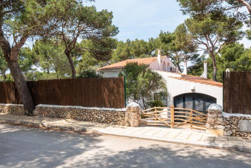 a house with a fence and a gate at Villa Los Dragones in Son Parc