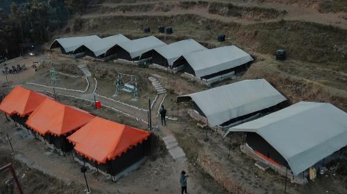 an overhead view of a group of buildings with white roofs at Camp O Royale in Dhanaulti