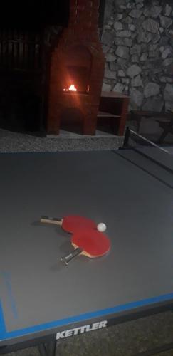 a table with a ping pong ball on top of it at Casa Laura in Orşova