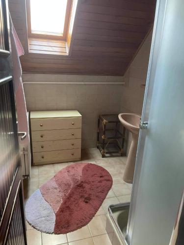 a small bathroom with a sink and a toilet at Iluska Vendégház in Kiskunmajsa