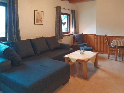 Χώρος καθιστικού στο Ferienwohnung Oberschledorner Wald