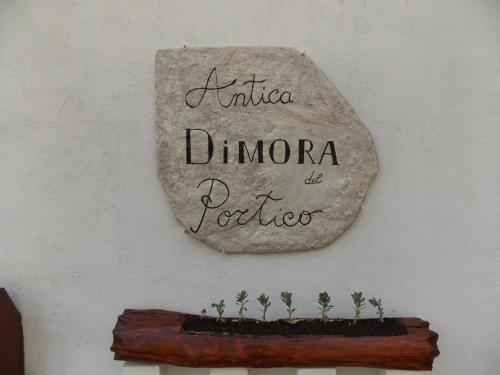 a sign on a wall that reads niuda dumora del portofer at Antica Dimora del Portico in Borgiallo
