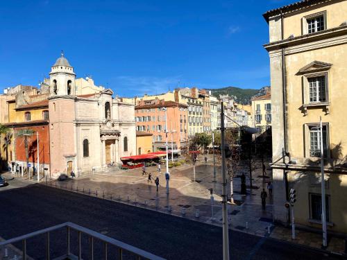 a view of a city street with a building at Marinca Port View Toulon in Toulon
