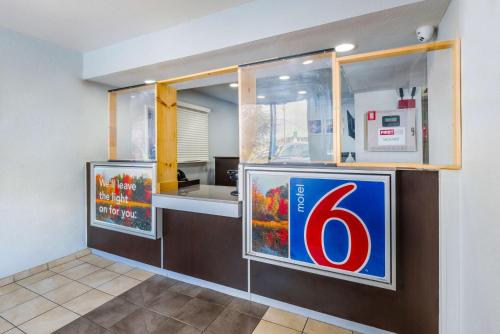 a kitchen with a number six sign on the wall at Motel 6-Sandston, VA - Richmond, Va in Sandston