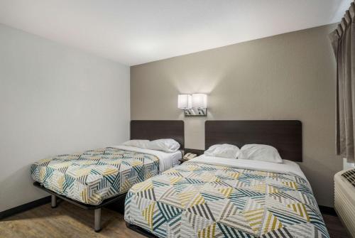 a hotel room with two beds in a room at Motel 6-Sandston, VA - Richmond, Va in Sandston