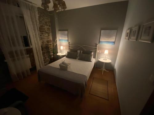 Ένα ή περισσότερα κρεβάτια σε δωμάτιο στο Hostal Casa San Nicolas